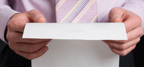 A man holding a letter